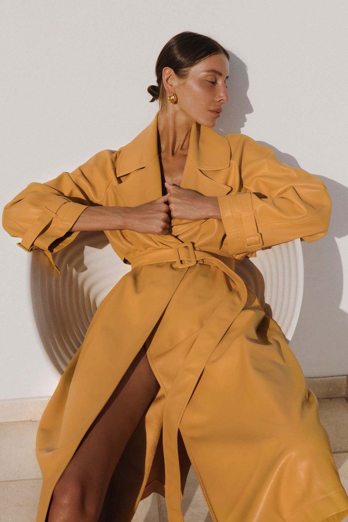 Julie Pelipas wears Yellow Eco-Leather Coat