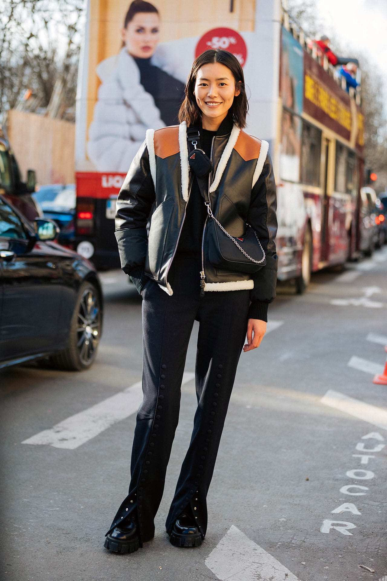 Liu Wen in Paris wearing Prada Re-Edition 2005 Black Nylon Shoulder Bag