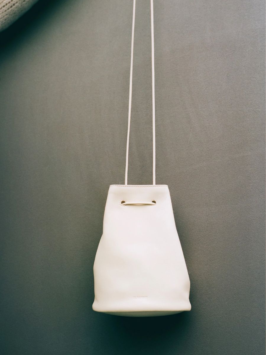 Clothing: Bag by Jil Sander. Photographer: Alessandro Mannelli. Stylist: Klio Kosuth
