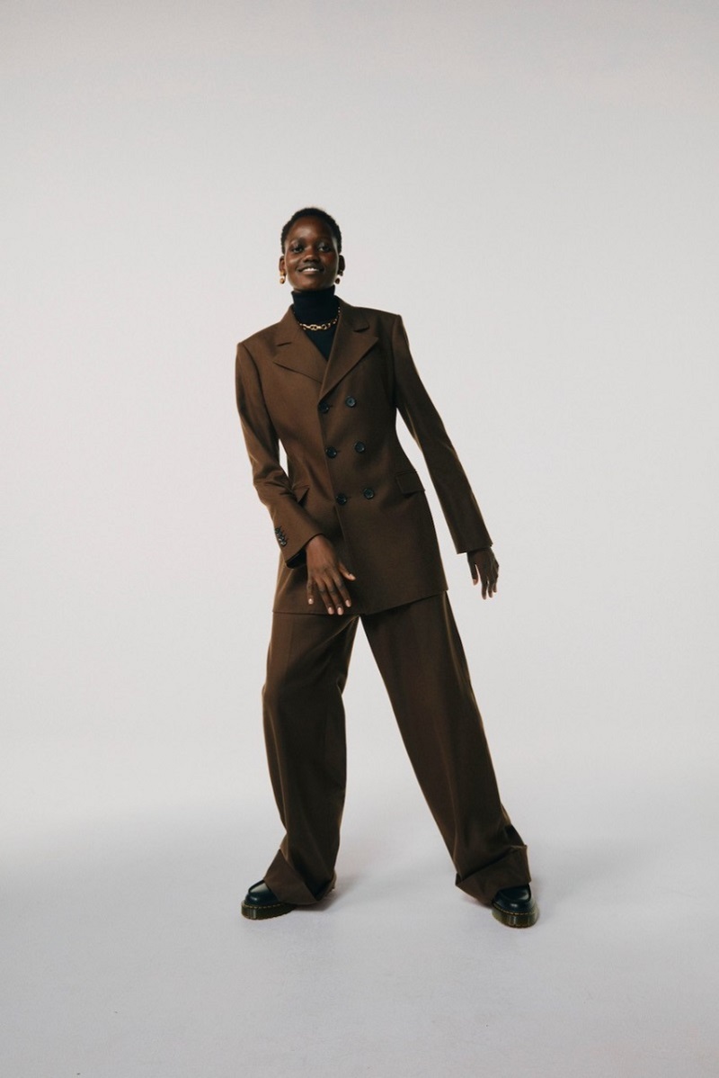 Wardrobe Foundations Matches Fashion Connolly Brown Suit Blazer and trousers, The Row Turtleneck Sweater, Comme des Garcons Shoes, Loewe Earrings, Sophie Buhai Necklace