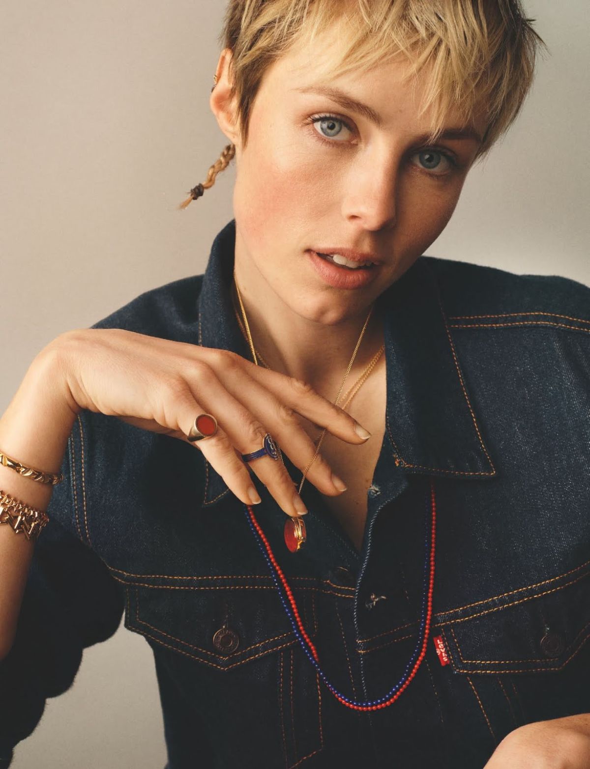 Clothing: Jacket, Jeans by Levi's / Jewelry by Ferian, Rosa de la Cruz, Louis Vuitton, Dior, Cartier, Rebus, Foundrae. Model: Edie Campbell. Stylist: Kate Phelan. Hair Stylist: Syd Hayes. Makeup Artist: Janeen Witherspoon