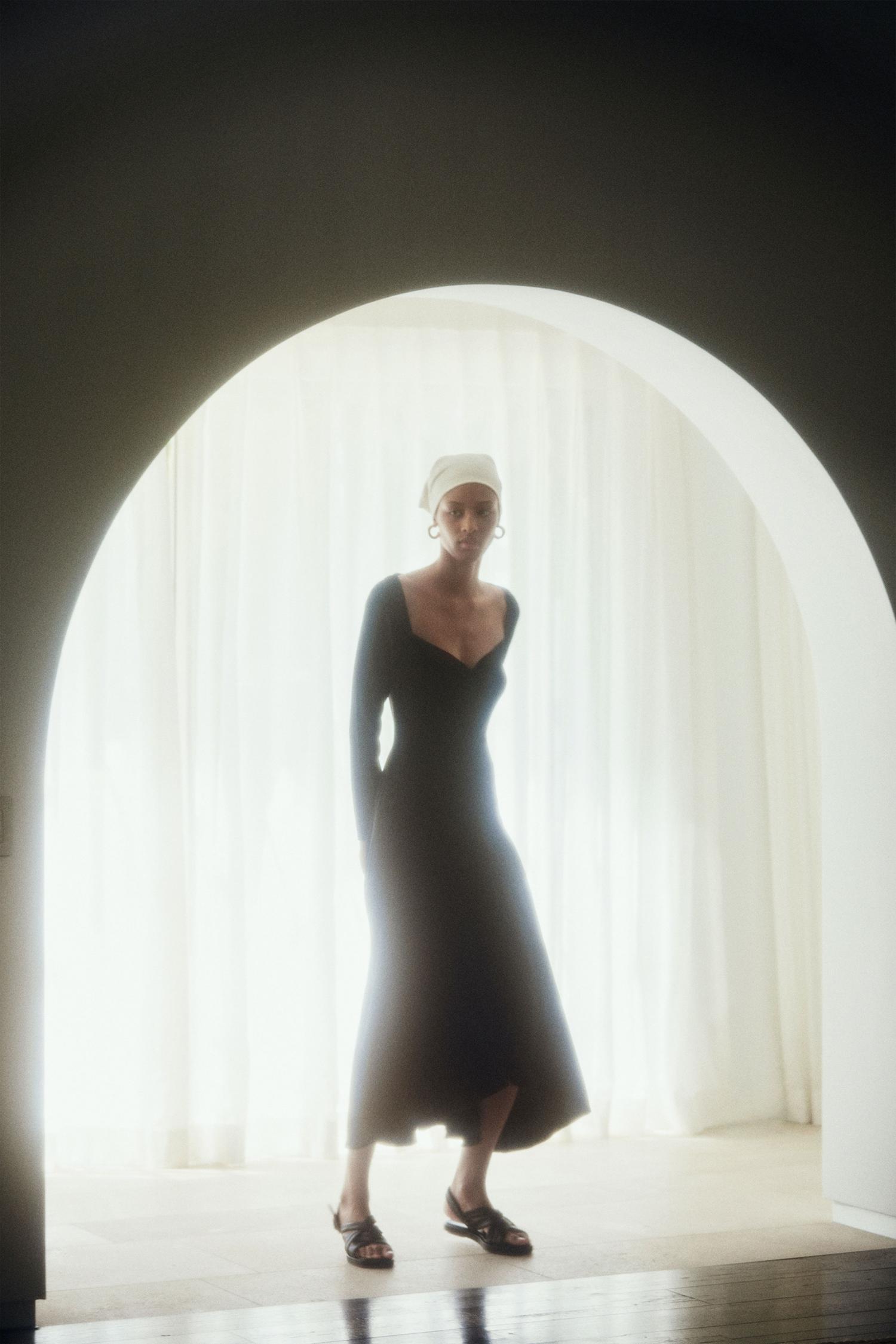 VINCE Black Ruched textured crepe midi dress. Photographer: Olivia Malone. Stylist: Sissy Chacon. Creative Director: Caroline Belhumeur