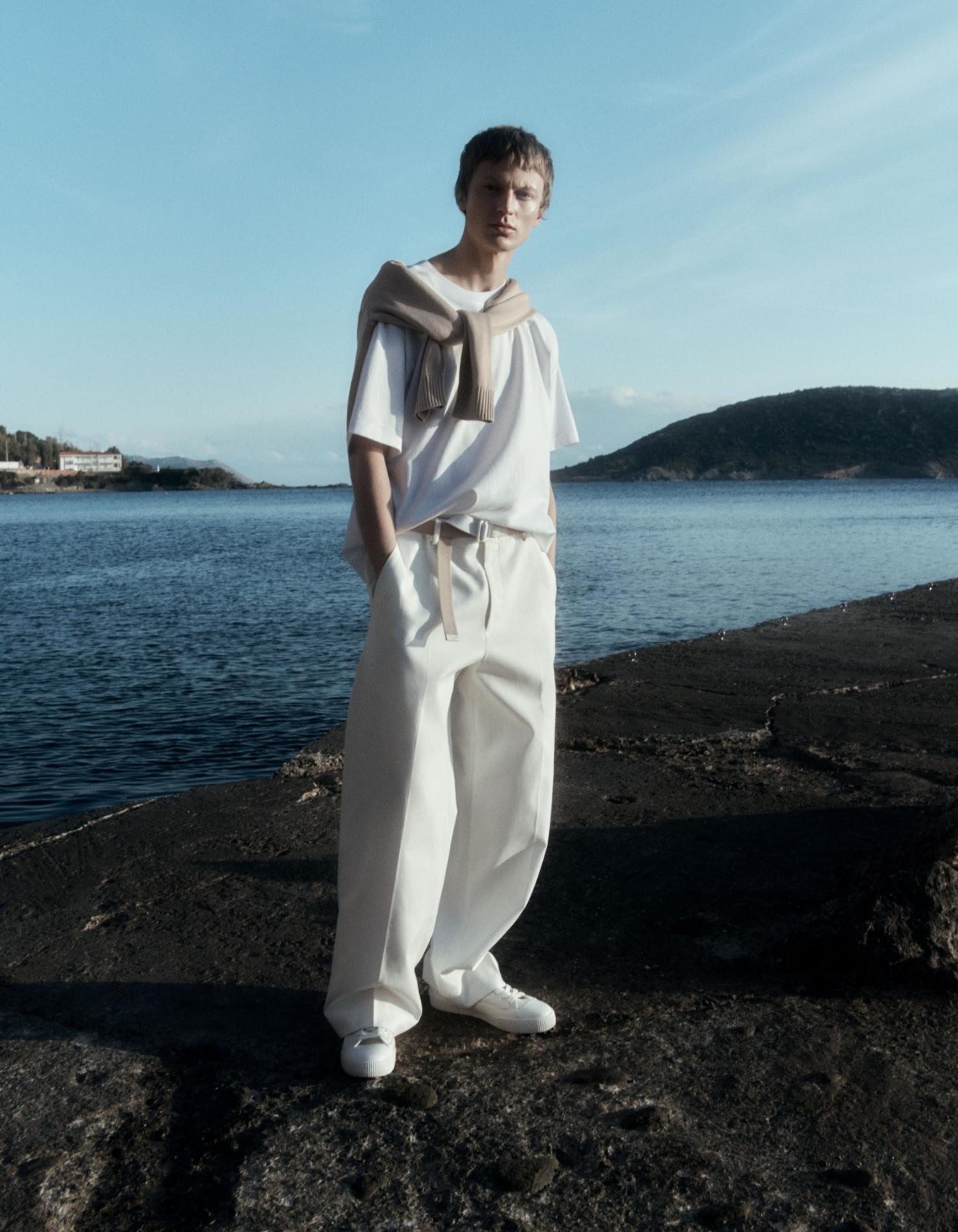 Jonas Gloer by Robin Galiegue for COS Summer 2021 Ad Campaign. Clothing & Accessories: COS WHITE OVERSIZED-FIT T-SHIRT / COS WHITE BEIGE REVERSIBLE BELT / COS WHITE LEATHER LACE-UP SNEAKERS