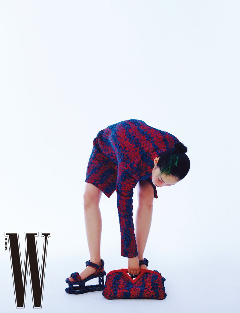 Clothing: Bottega Veneta Red Single-breasted bouclé coat / Bottega Veneta Ladybug & Silver Compact bubble bouclé top handle bag / Model: Hyun Ji Shin. Photographer: Hyea W. Kang. Fashion Editor: Lee Yeji