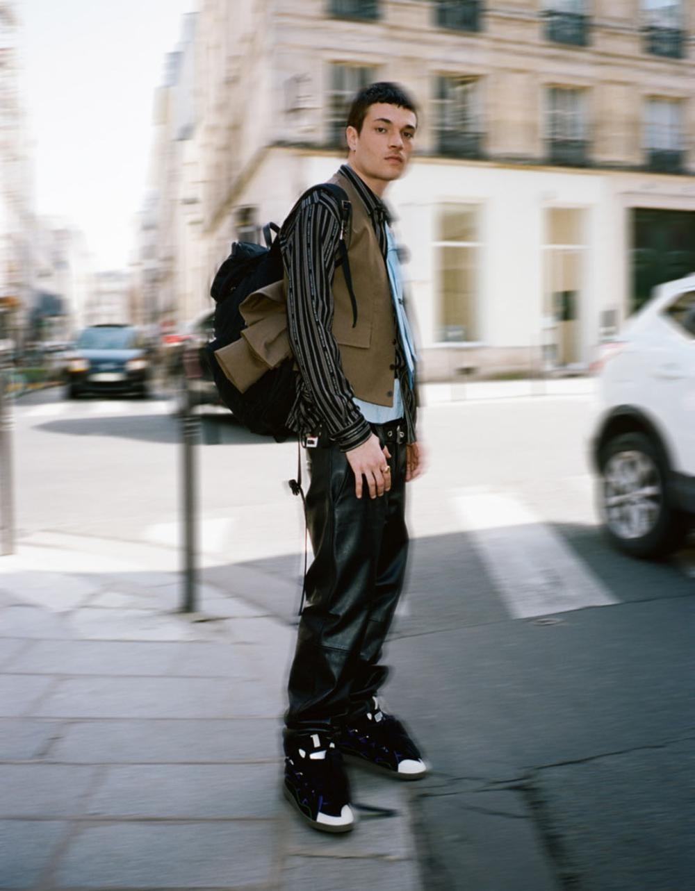 Clothing & Accessories: Jacket, Vest by Ermenegildo Zegna / Shirt by Dior / Pants by 032C / Underwear by Uniqlo / Sneakers by Lanvin / Prada Re-Nylon multi-pocket backpack / Tie by Charvet / Luka Isaac by Pierre-Ange Carlotti for Vogue Ukraine Man Spring-Summer 2021