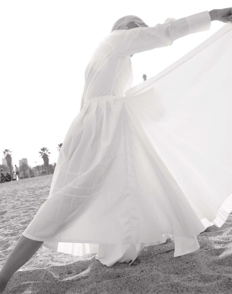 Clothing: Jil Sander White Neck-tie pleated cotton-poplin wrap dress / Photographer: Mark Rabadan. Stylist: Anna Schiffel. Beauty Artist: Egon Crivillers
