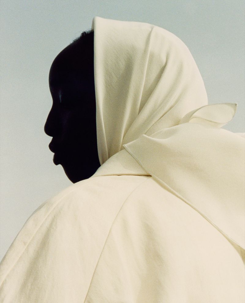 Nyaueth Riam by Jack Davison for The Row Spring-Summer 2021 Ad Campaign, Cream Oswin oversized trench coat