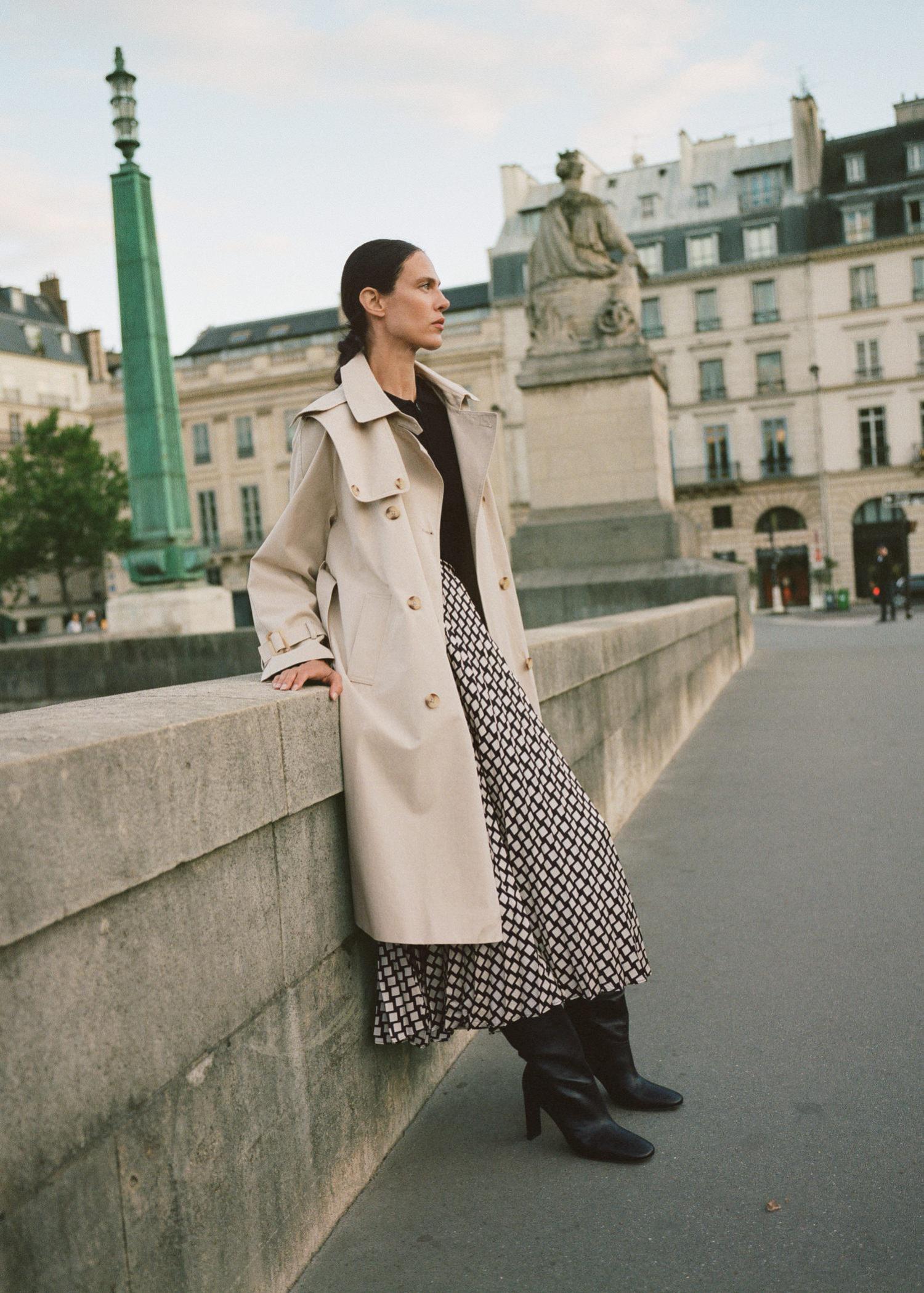  Aymeline Valade in Paris by Alejandro Sonoro for Mango Fall 2021 Ad Campaign. Clothing: Mango Trench coat with detachable hood / Mango High heel leather boot