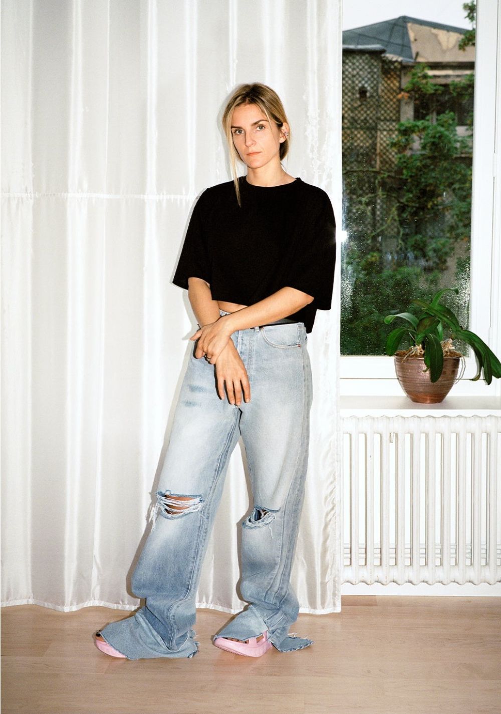 Gaia Repossi by Jack Day for Matches Fashion Fall-Winter Wardrobe Edit Vaara Black Kelly cropped cotton-jersey T-shirt Vetements Blue Split-cuff wide-leg denim jeans Givenchy Pink Marshmallow cutout slides