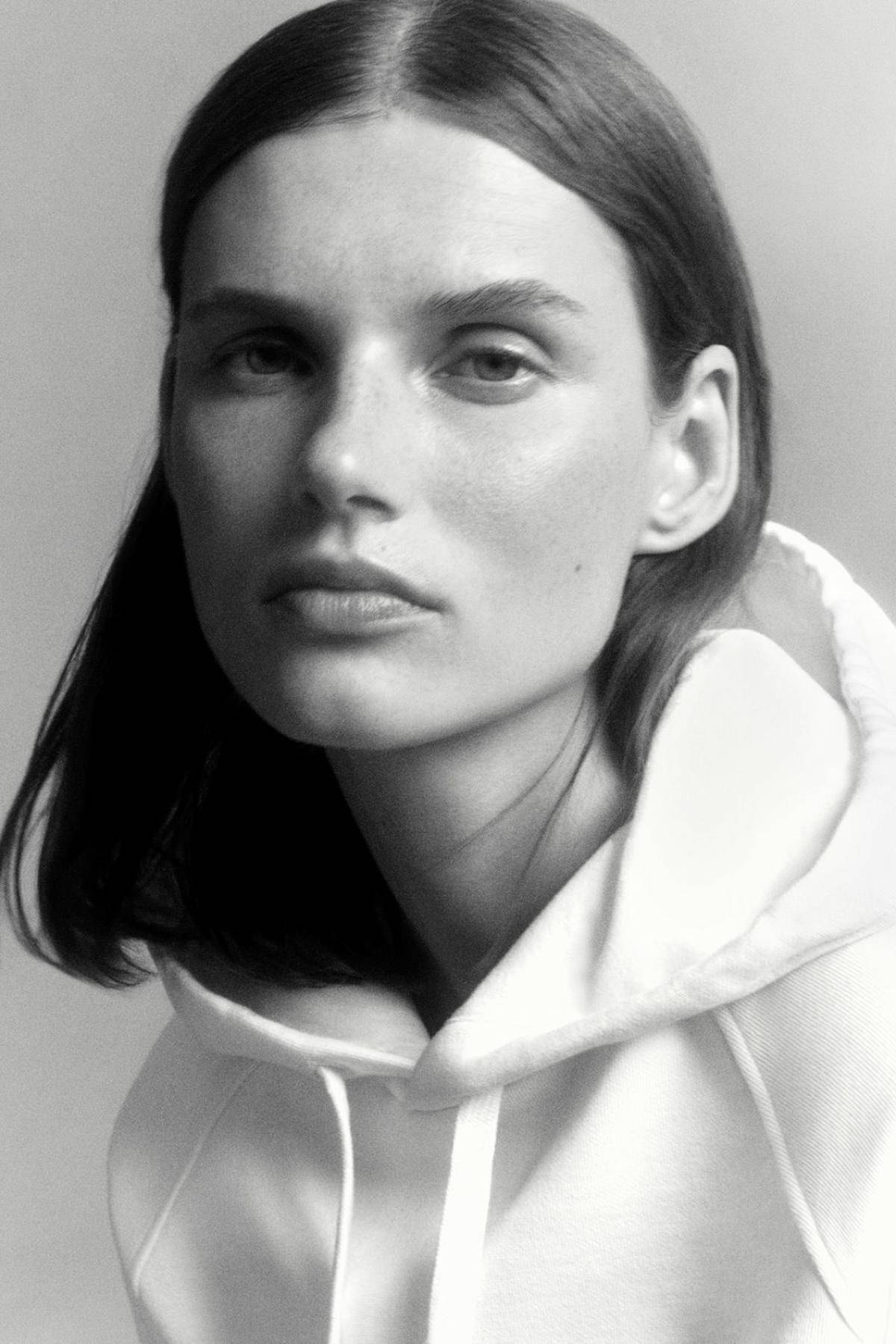 Giedre Dukauskaite by Robin Galiegue for COS Leisurewear Fall 2021 Ad Campaign. Clothing: COS WHITE RELAXED-FIT HOODIE