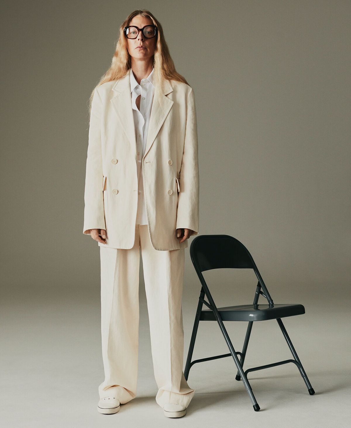 Clothing & Accessories: The Row White Tihana cotton-blend gabardine blazer / The Row Igor double-pleat cotton-blend wide-leg trousers / The Row Carla long-sleeved chiffon shirt / Re/Done White 70s canvas trainers / Celine Eyewear Brown Square tortoiseshell-acetate glasses Hybrid Dressing: Laura Morgan by Sarah Piantadosi for Matches Fashion Fall-Winter 2021 Ad Campaign