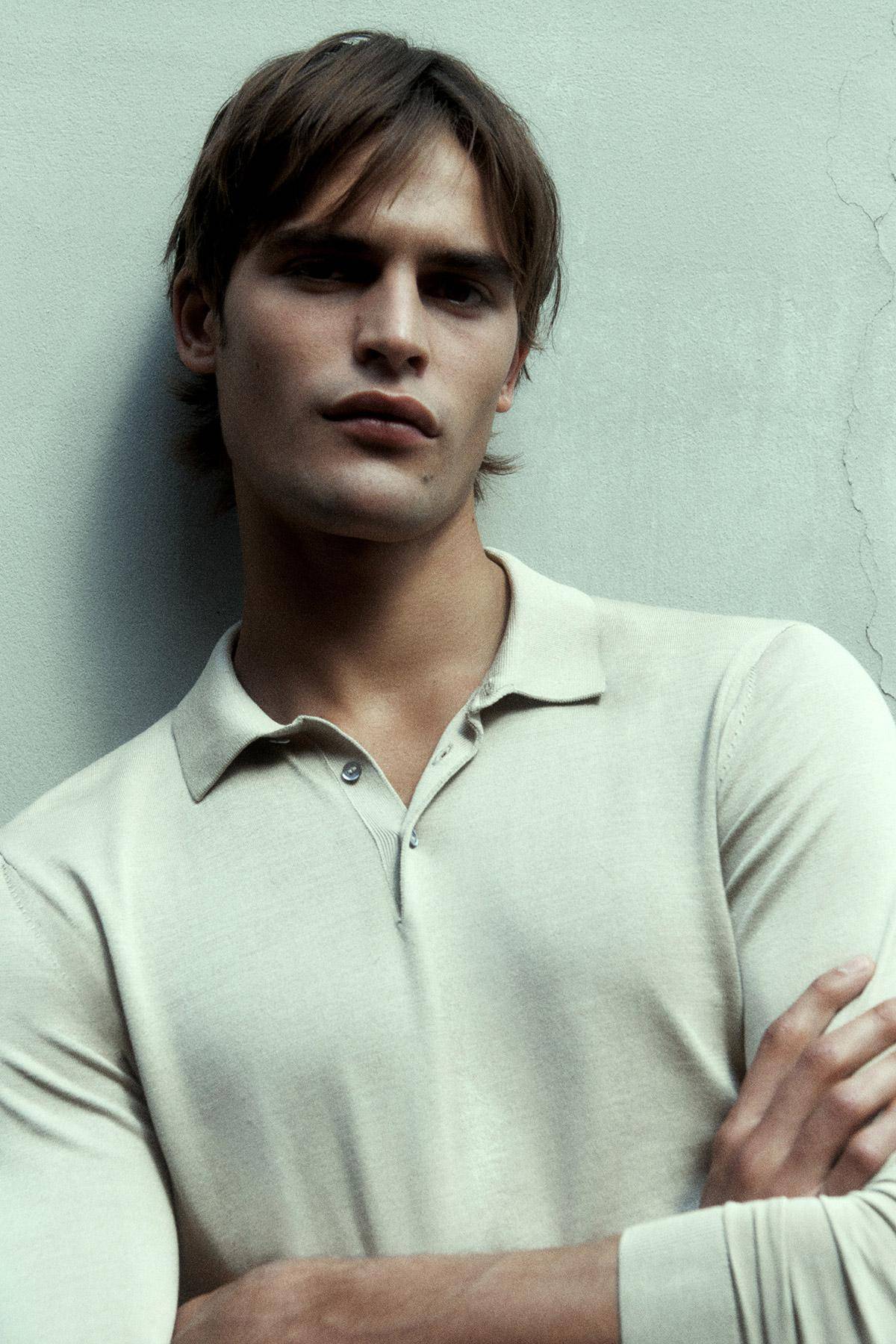Parker van Noord by Robin Galiegue for Men's Core by COS Fall 2021 Ad Campaign. Clothing: COS LIGHT KHAKI GREEN SLIM-FIT LONG-SLEEVE POLO SHIRT