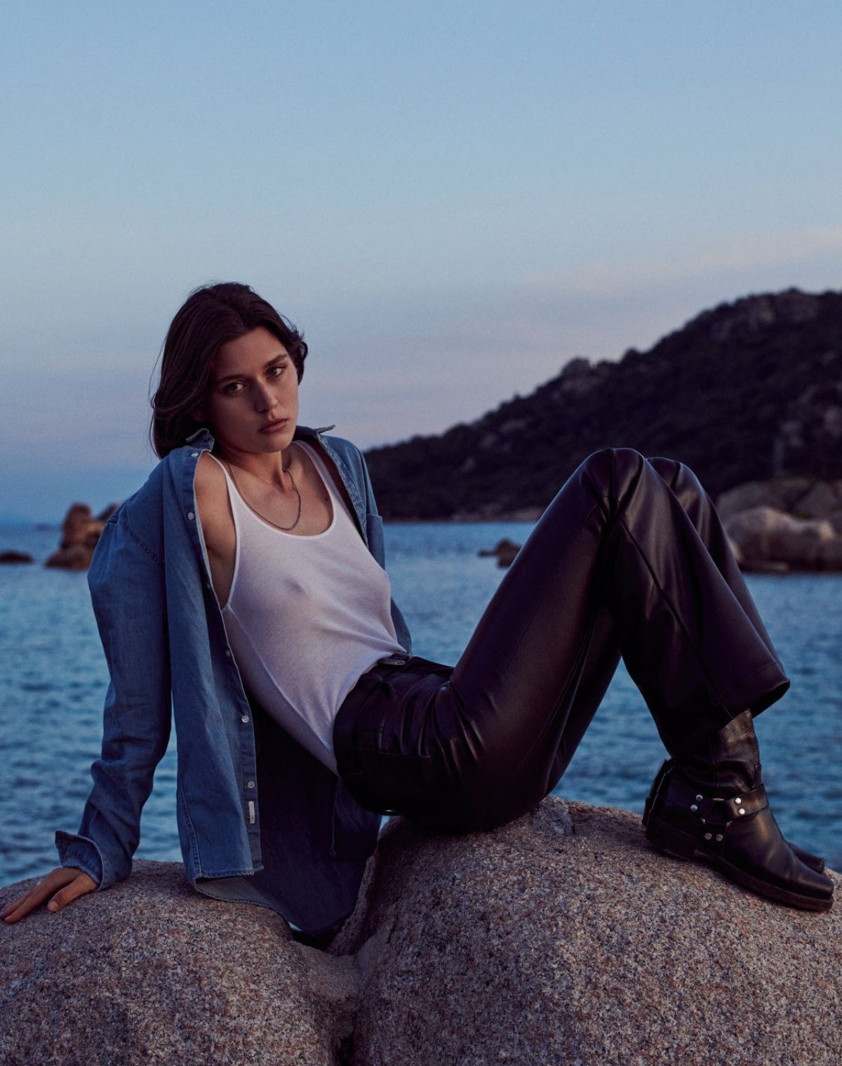 The Great Escape: Vivienne Rohner in Corsica by Bruno Staub for Vogue Paris August 2021. Clothing & Accessories: Denim Shirt by IKKS Men; Tank Top by Majestic Filatures; Vegan Leather Trousers by Chapel; Belt by Harpo x Beige Habilleur; Leather Boots by Re/Done