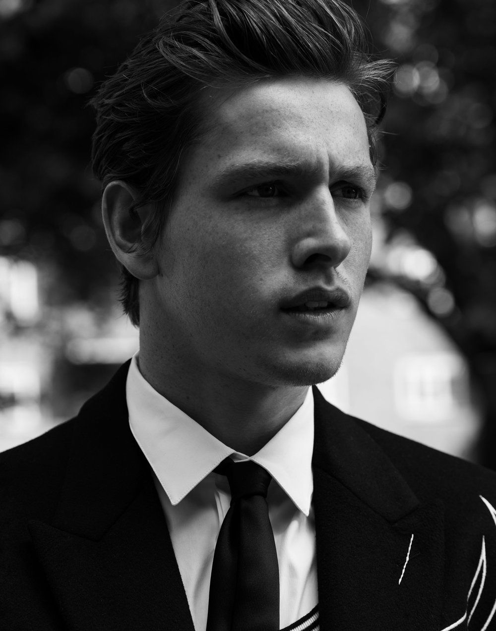 DIOR HOMME coat, shirt, and tie. Photographer: Justin Campbell. Stylist: Jay Hines. Groomer: Jody Taylor