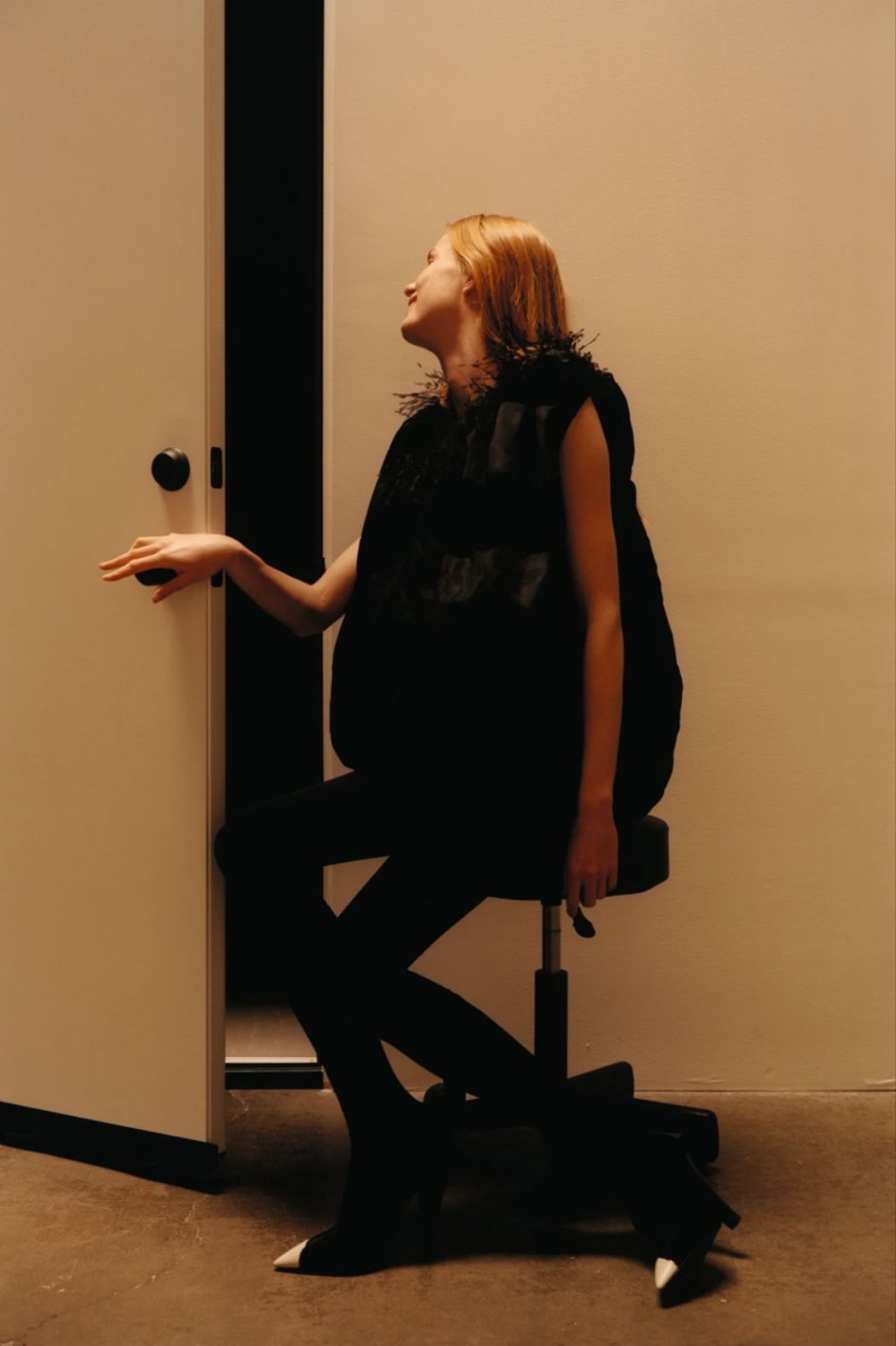   Clothing & Accessories: Saint Laurent by Anthony Vaccarello / Model: Rianne van Rompaey. Photographer: Colin Dodgson. Stylist: Alastair McKimm. Set Designer: Spencer Vrooman
