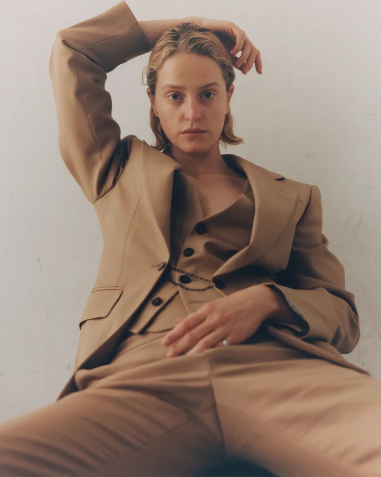 Daria Polunina by Lukasz Pukowiec for Vogue Ukraine March 2019. Clothing: Wool jacket and wool trousers by Vivienne Westwood 