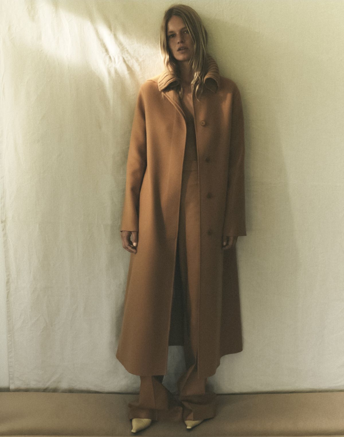 Into the Light: Anna Ewers by Annemarieke Van Drimmelen for Harper's Bazaar November 2021. Clothing & Accessories: Loro Piana coat and pants; Kwaidan Editions mules