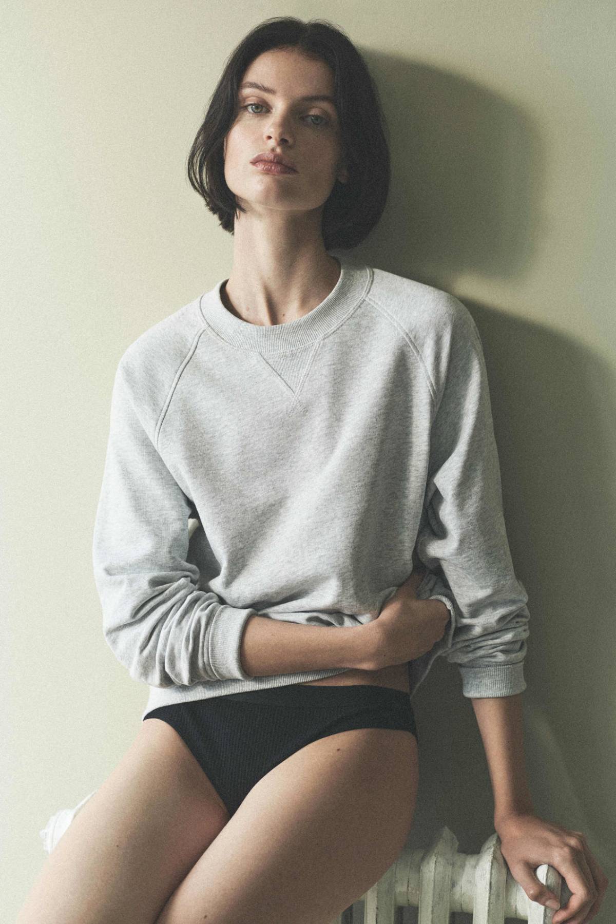 Women's Loungwear Pause by COS Fall-Winter 2021 Ad Campaign Clothing: COS LIGHT GRAY RELAXED-FIT TERRY SWEATSHIRT / COS BLACK RIBBED BRIEFS