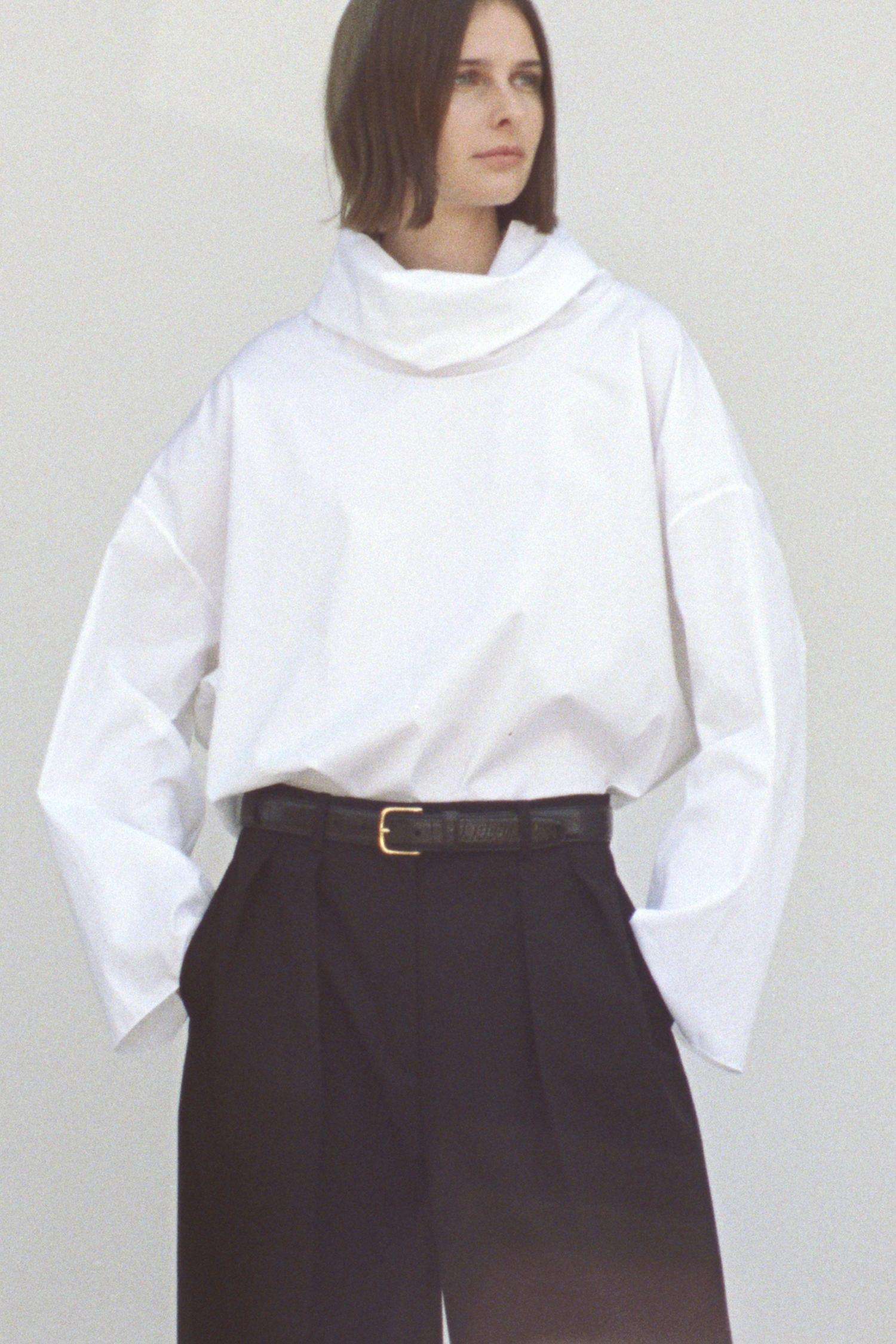 The Row White Shirt and Black Pleated Pants Outfit