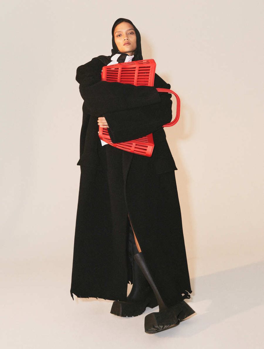 Charlotte Carey by Mattias Bjorklund for Elle Sweden January 2022 Coat and Scarf, Bag, Black Trooper rubber boots Balenciaga