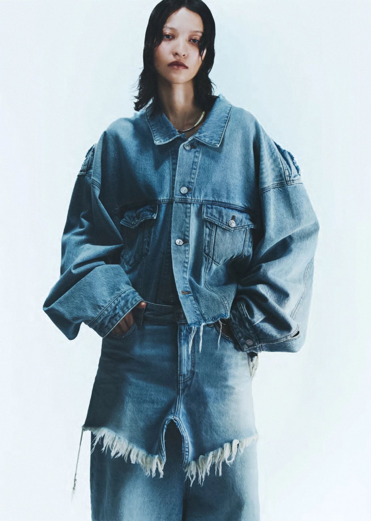 America Gonzalez by Thue Norgaard Balenciaga Deconstructed Organic-Denim Jacket, Deconstructed Denim Mini skirt and Blue Dropped-seat wide-leg jeans