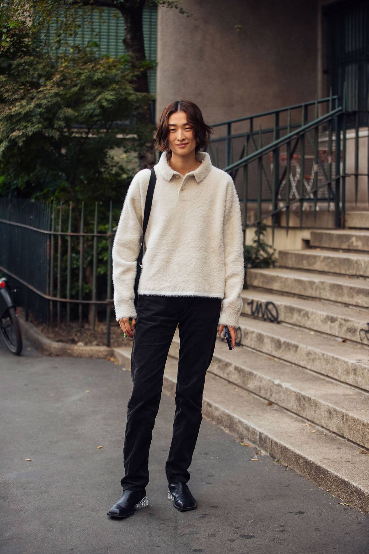 Chu Wong wears Jacquemus White Neve fluffy-knit polo sweater at Milan Fashion Week Spring-Summer 2023