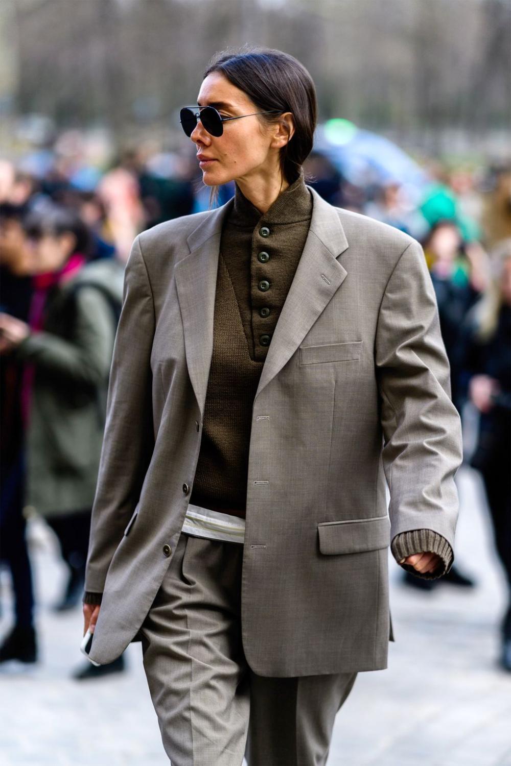 Julie Pelipas wears BETTTER Gray Hourglass upcycled wool-blend blazer and BETTTER Gray pleated wool-blend straight-leg pants