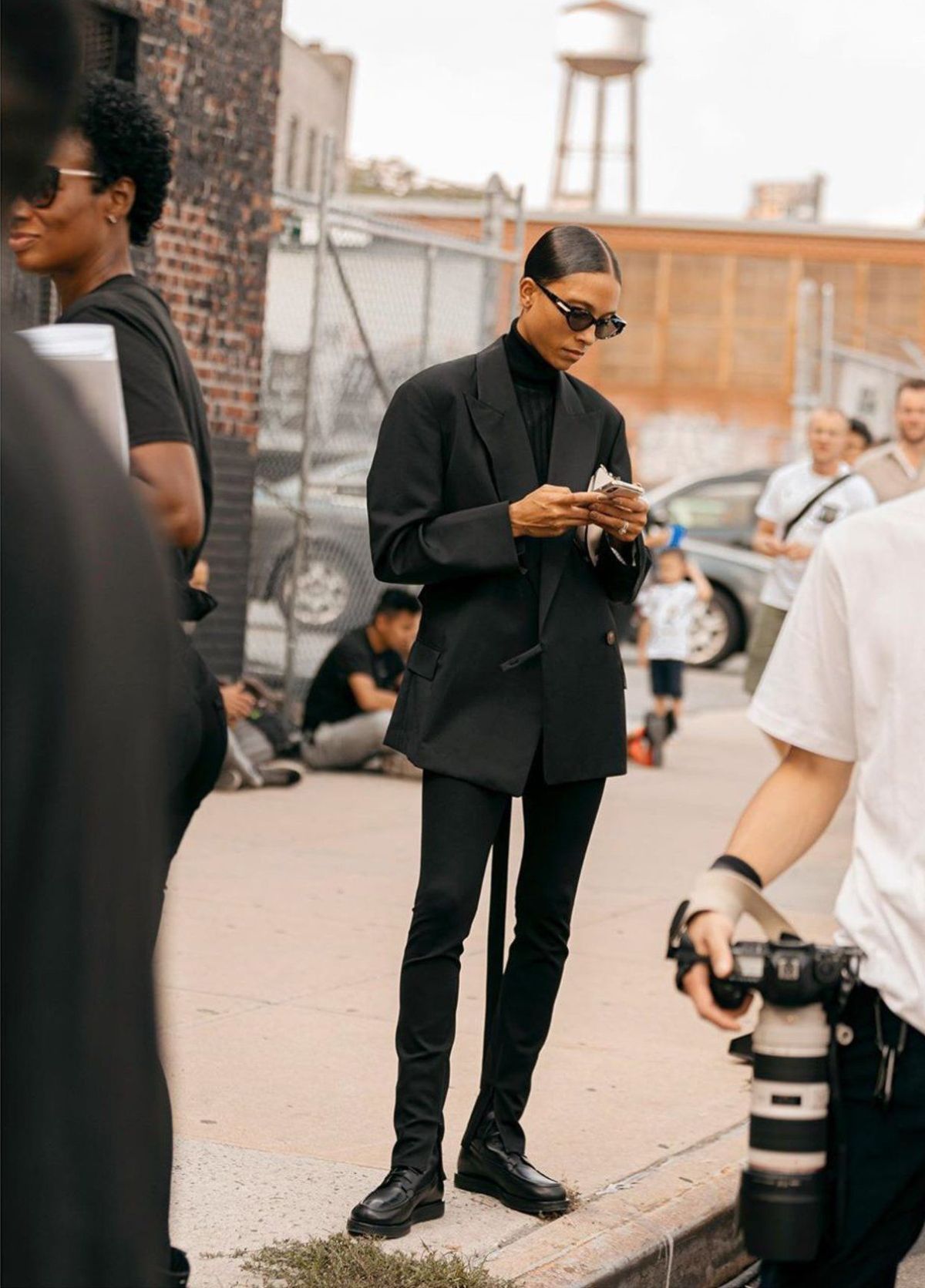 TyLynn Nguyen wears Acne Studios Black Oversized Blazer and The Row Black Boots in New York