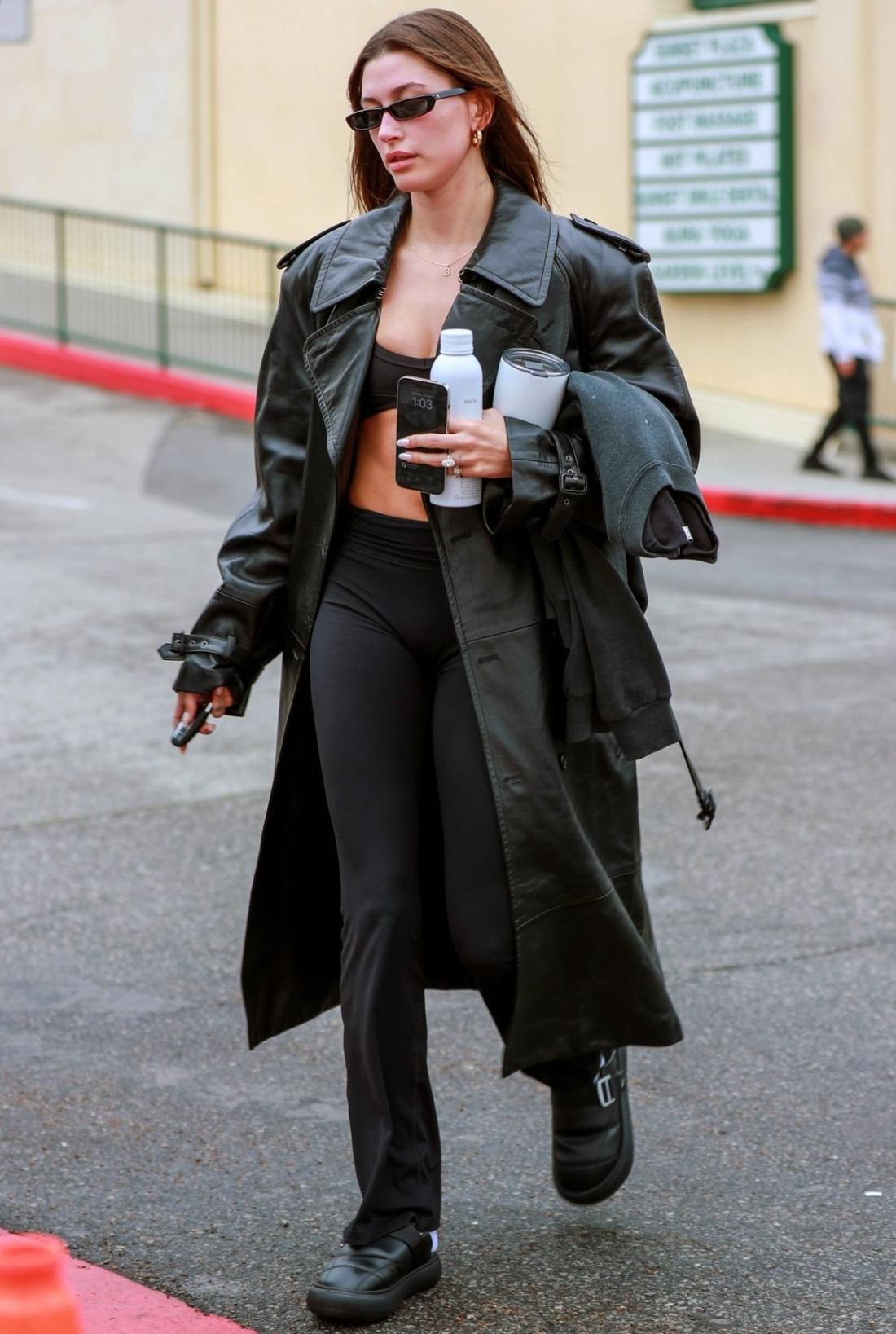 https://fashionfav.com/wp-content/uploads/2023/05/Hailey-Bieber-wears-All-Black-Leather-Coat-Sports-Bra-Yoga-Leggings-Sneakers-in-West-Hollywood.jpg