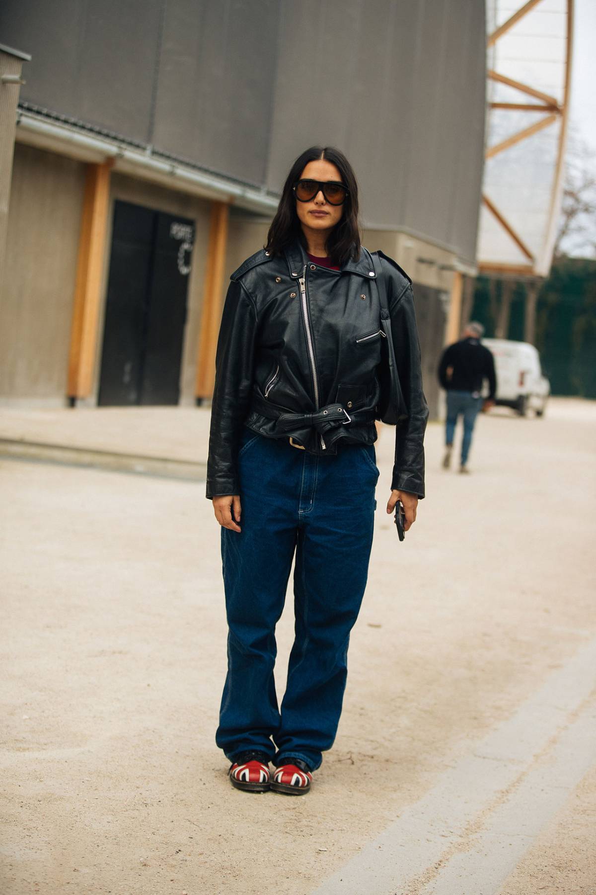 Jill Kortleve Black Biker Jacket and Navy Wide Jeans Off-Duty Model Outfits at Paris Fashion Week Fall-Winter 2023