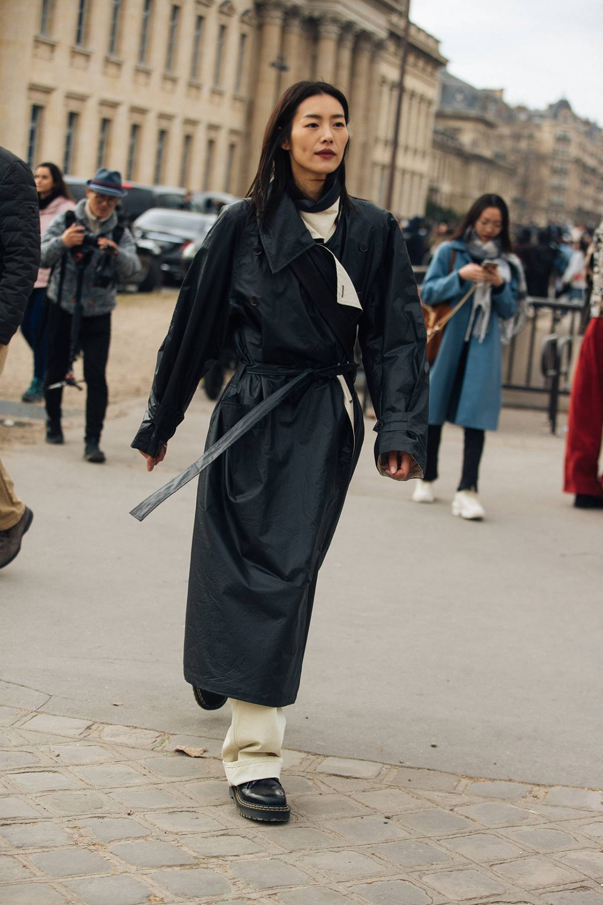Liu Wen wears Black Leather Coat and Dr. Martens Shoes Off-Duty Model Outfits at Paris Fashion Week Fall-Winter 2023