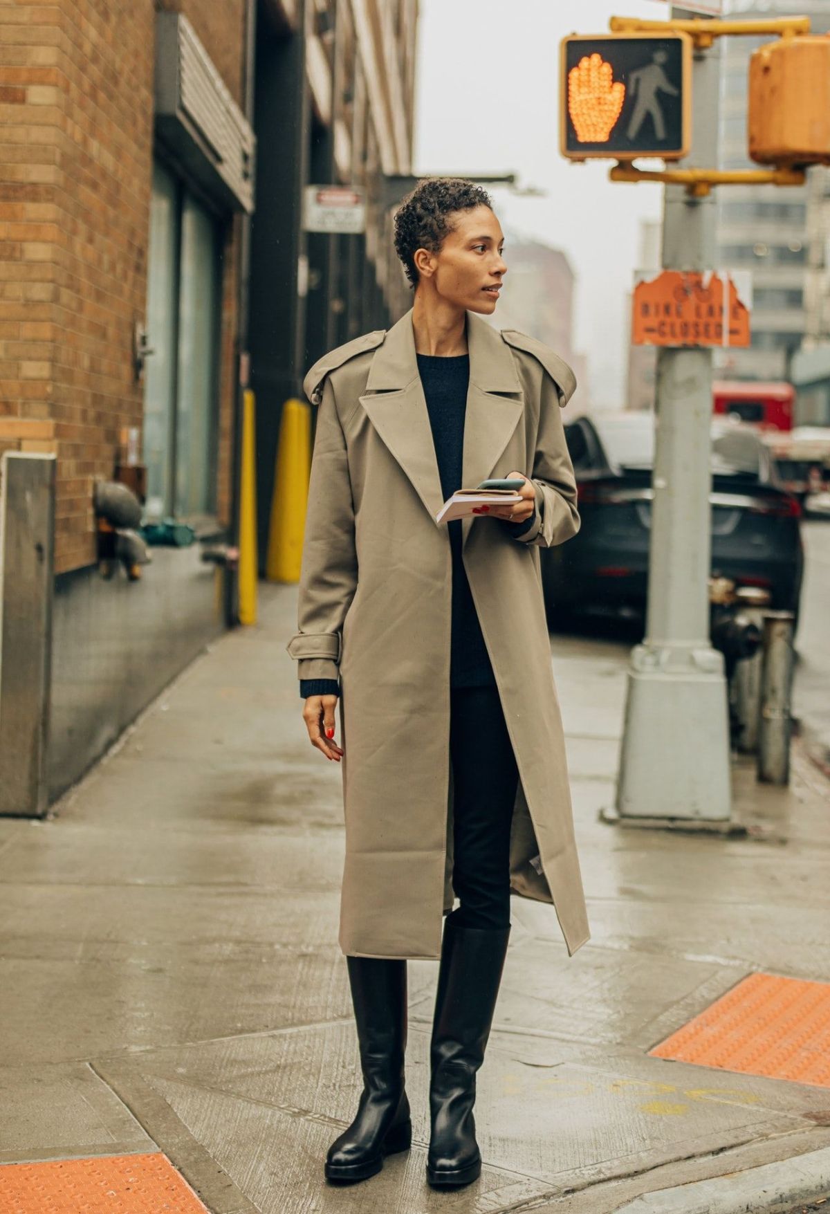 Refined Minimal Fashion Tylynn Nguyen wears Camilla and Marc Neutral Trench Coat, The Row Black Leather Knee-High Boots