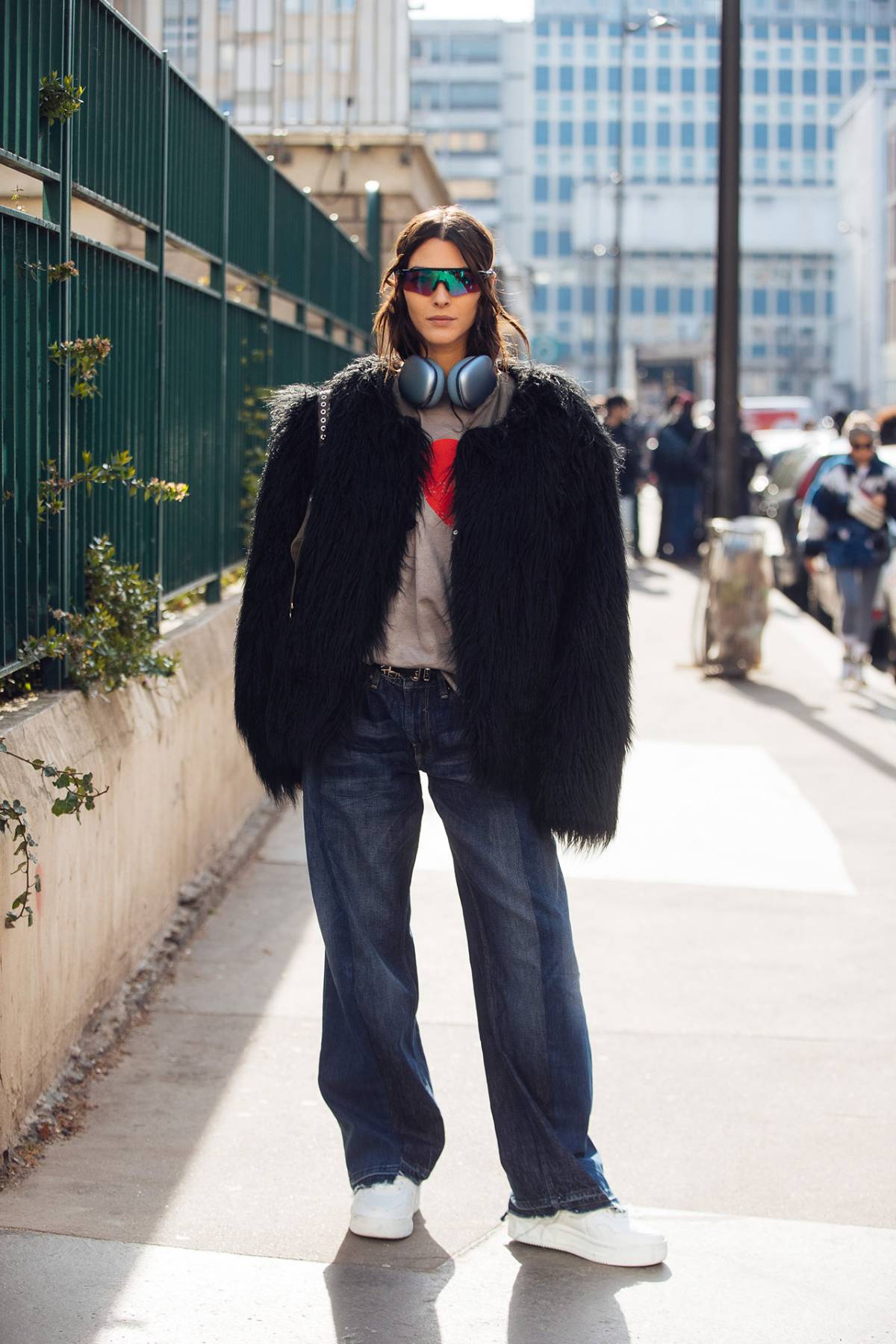 Vittoria Ceretti wears Black Faux Fur Jacket and Wide-Leg Jeans at Paris Fashion Week Fall-Winter 2023