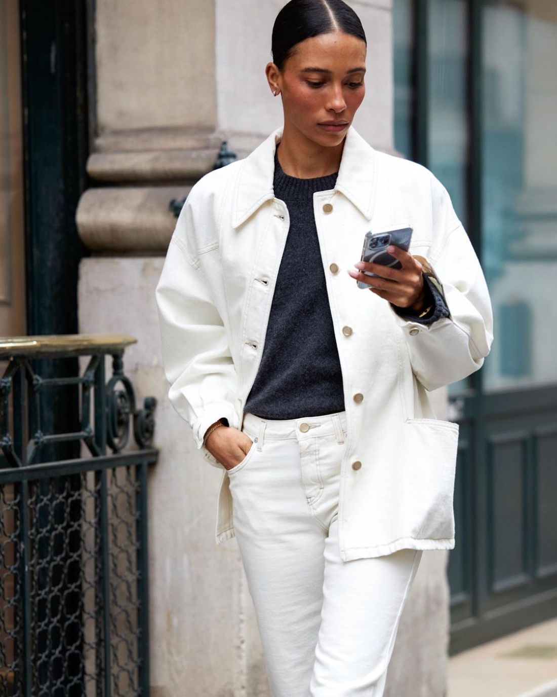 TyLynn Nguyen in  Closed White button-up Cotton Denim Jacket and Closed White high-rise Straight Jeans, Grey Sweater Outfit