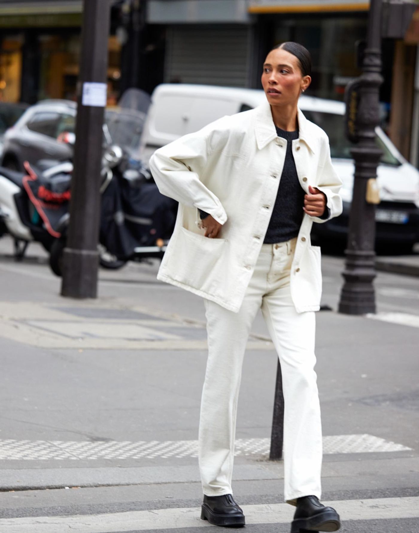 TyLynn Nguyen wears Closed White Denim Jacket and Jeans, The Row Black Zipped I Ankle Boots