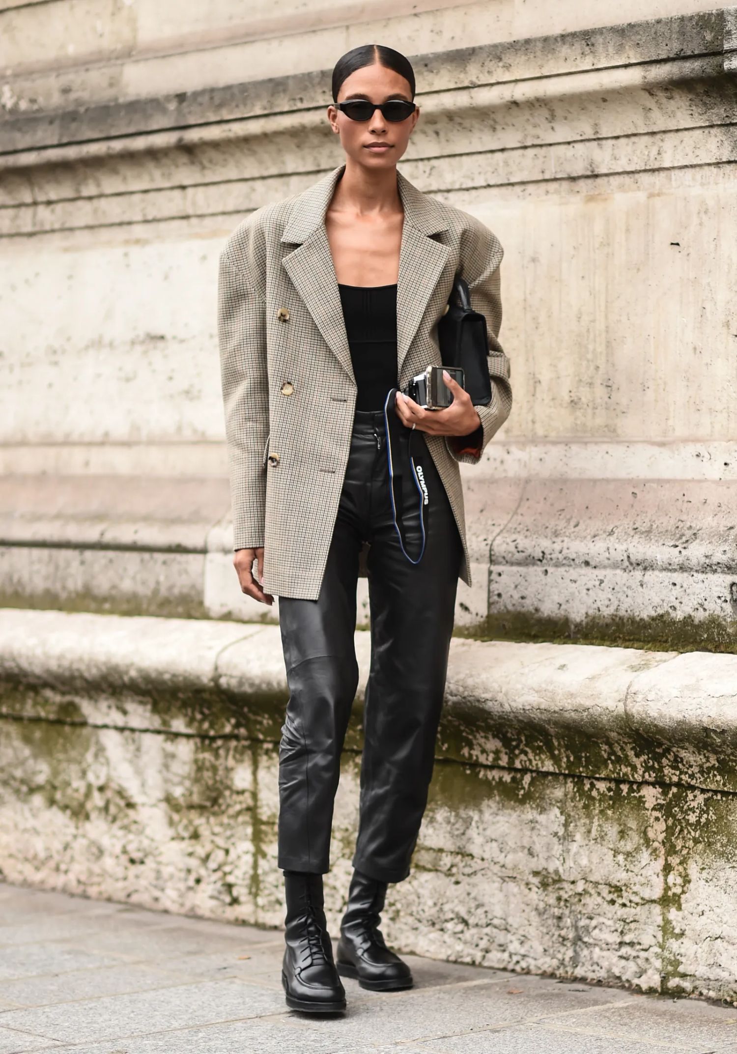 Tylynn Nguyen wears The Row Leather Pants, Oversized Checked Blazer with Large Shoulder Pads Refined Minimal Fashion
