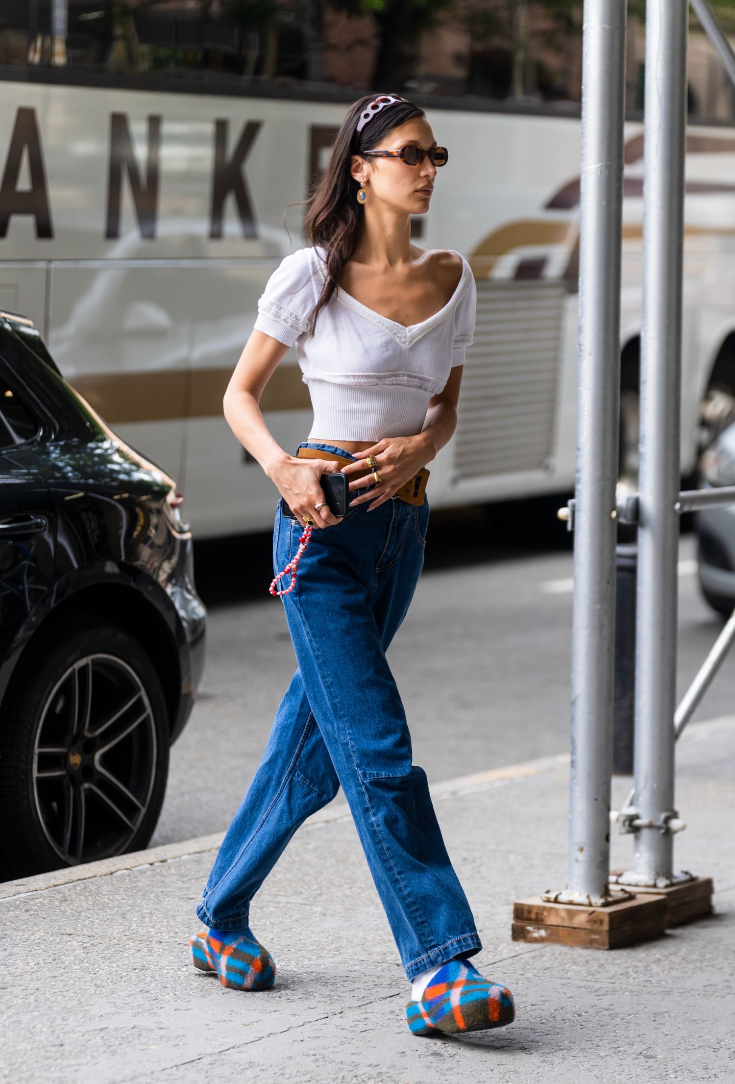 Bella Hadid in White Cropped Top, Eytys Titan Tuck Stone Blue Jeans, Simon Miller Plaid Bubble Clogs, Dmy by Dmy Valentina Sunglasses