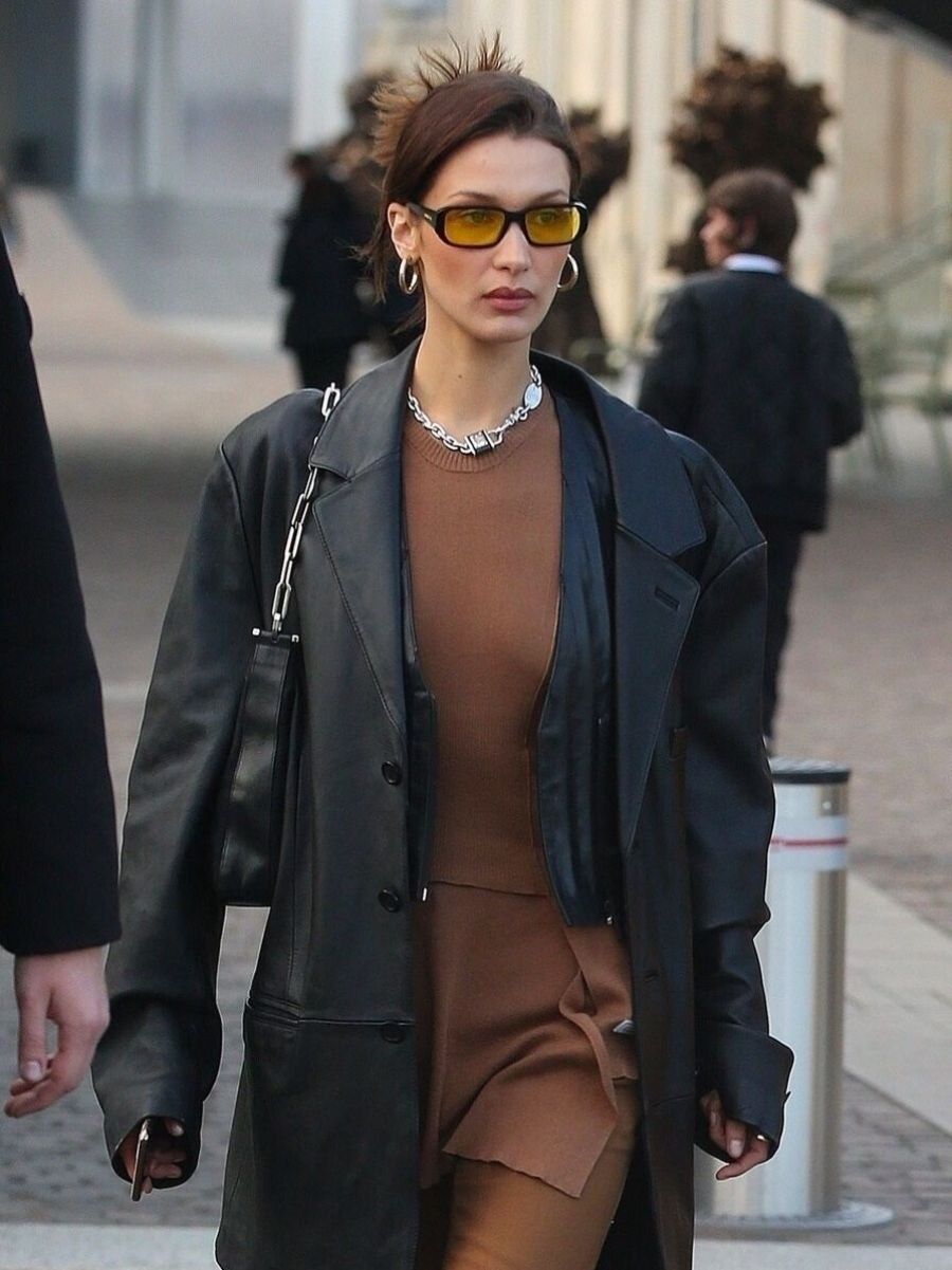 Bella Hadid wears 90s Black Leather Jacket Outfit Arnette Post Malone AN 4265 Yellow Lens Sunglasses