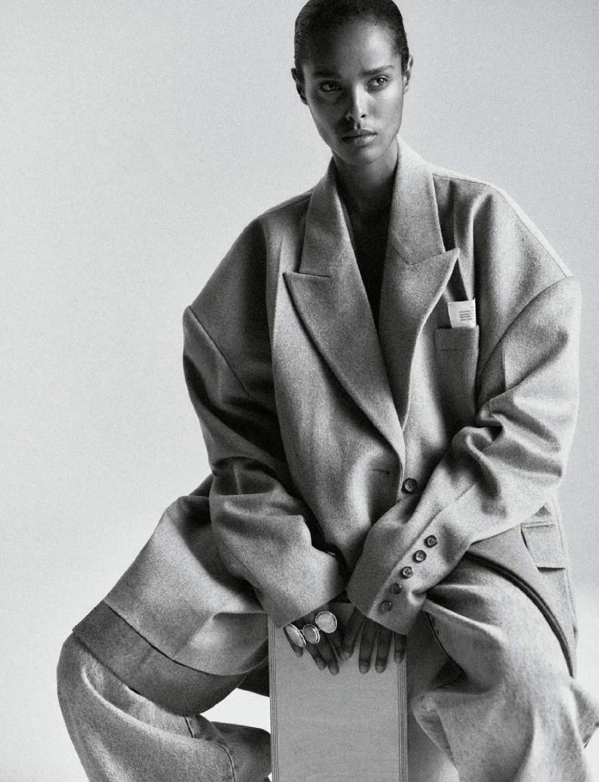 Malika Louback in Rokh Coat and Jeans by Chris Colls for Elle France August 2023