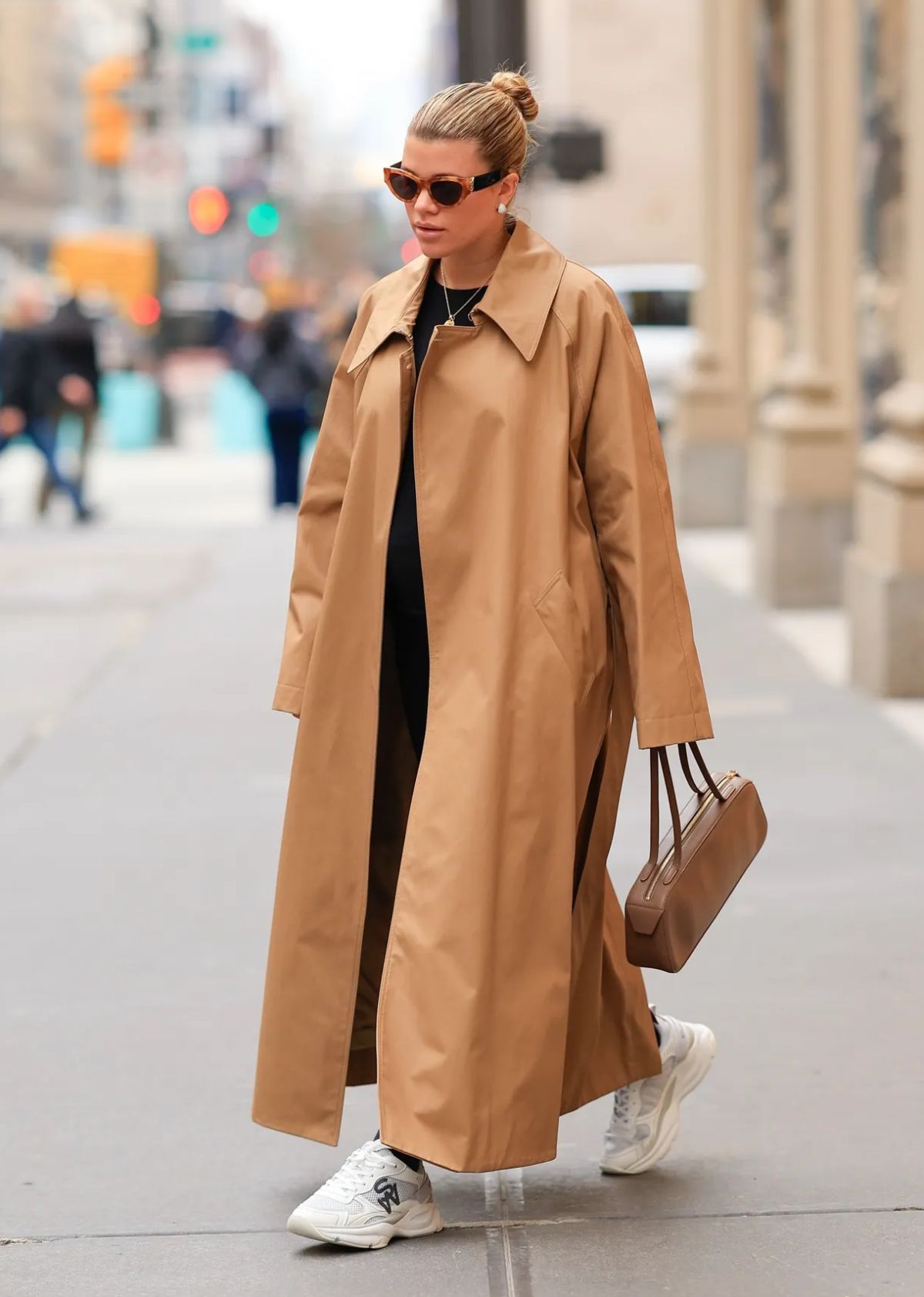 Sofia Richie Grainge wears Khaite Minnie Trench Coat with Stuart Weitzman Chunky Sneakers in New York City