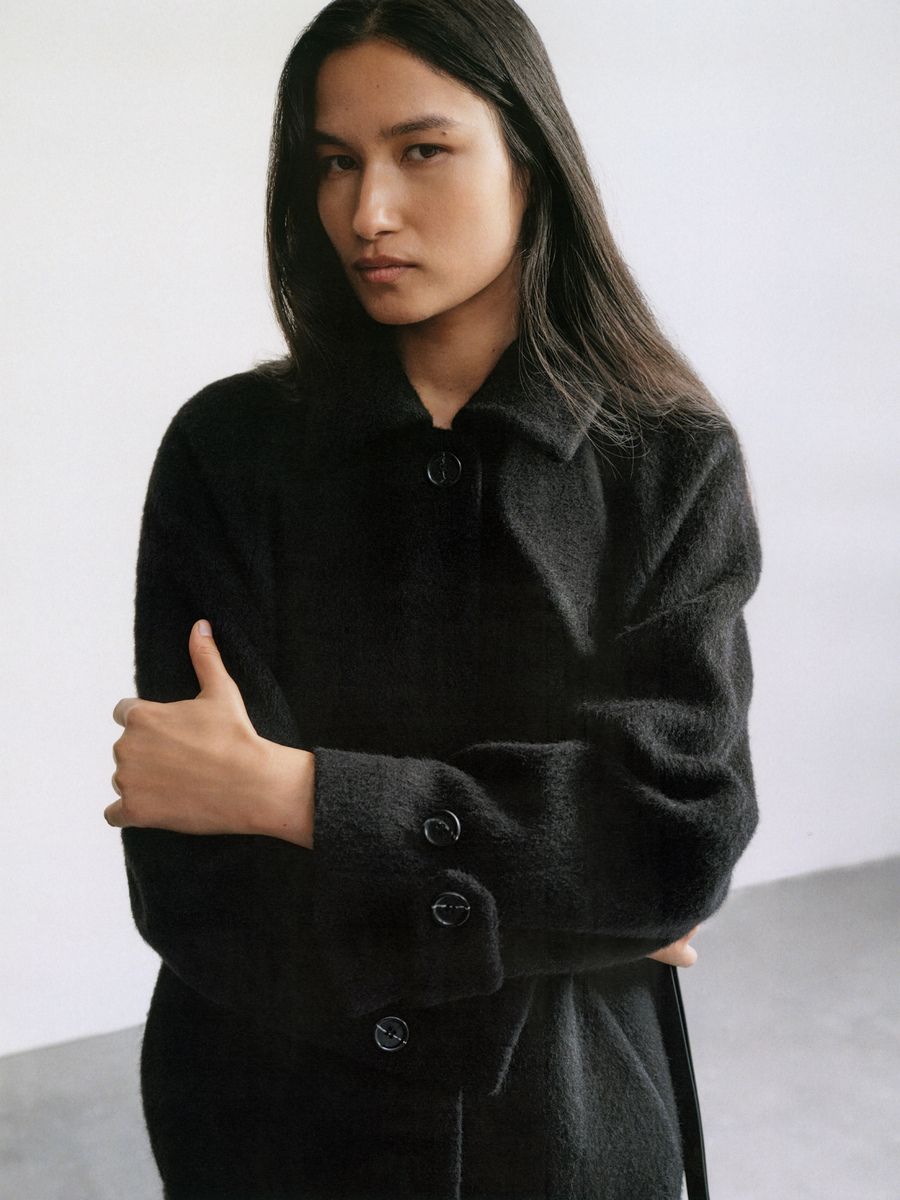 Varsha Thapa wears Arket Black Coat Fall-Winter 2023 Layers