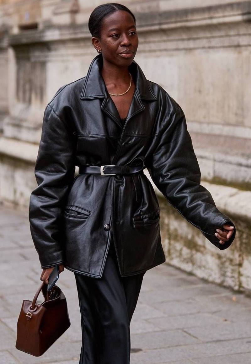 Sylvie Mus wears Black Silk Dress, Oversized Belted Leather Jacket