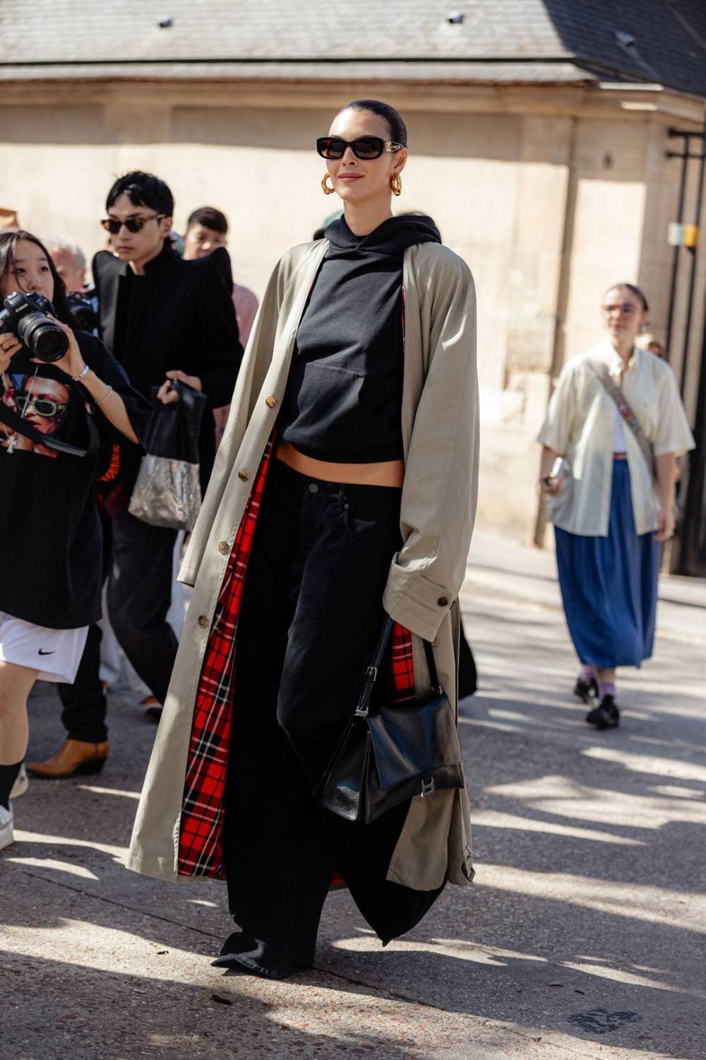 Vittoria Ceretti wears Balenciaga Beige Cotton-gabardine maxi trench coat in Paris