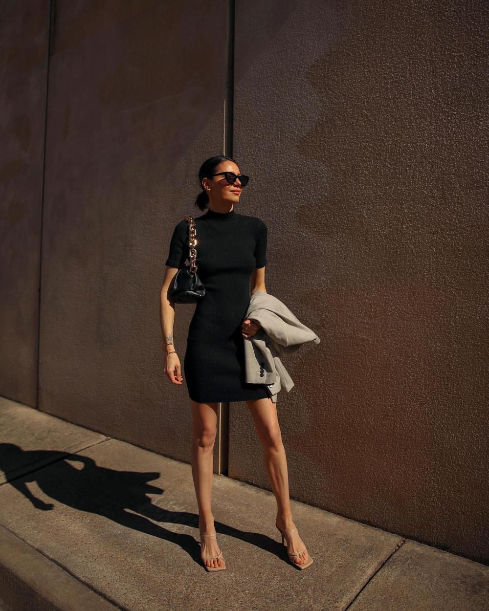 Petra Mackova Minimalist Outfits Black Mini Dress, Bottega Veneta Black Leather Pouch Chain Bag